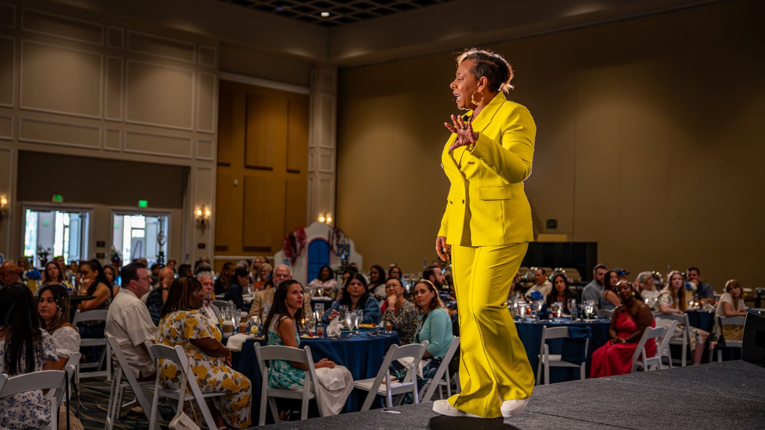 Kelly Charles-Collins, Esq. addressing a room